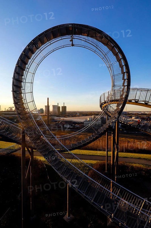Tiger and Turtle, Magic Mountain is a landmark modelled on a roller coaster, the large sculpture is a walk-in work of art by Heike Mutter and Ulrich Genth, which was developed as part of the Ruhr.2010 Capital of Culture, behind HKM Hüttenwerke Krupp Mannesmann and RWE Power AG, Duisburg, Ruhr area, North Rhine-Westphalia, Germany