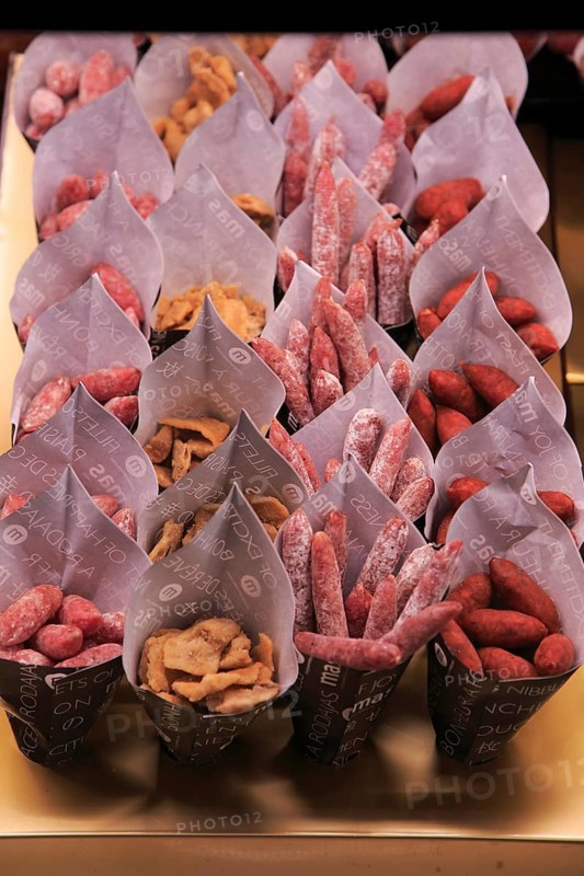 Small sausages packed for sale, Mercado San Miguel market, Madrid city centre, Spain