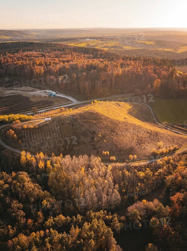Aerial view of autumnal forests and hills with fields and roads, industrial area Lindenrain, Gechingen, Black Forest, Germany