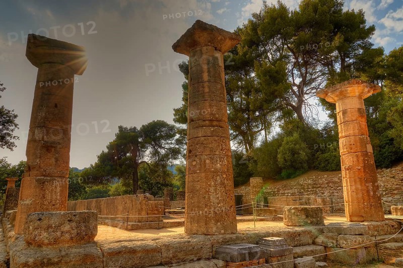 Temple of Hera, Heraion, monumental columns standing all around in golden evening sun, archaeological site, Ancient Olympia, Olympia, Peloponnese, Greece
