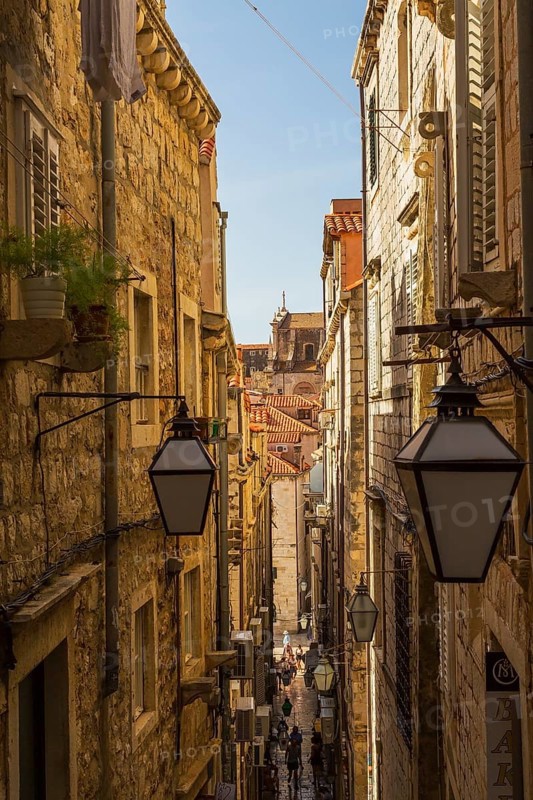 High angle view of narrow street with tourists and visitors in old walled city of Dubrovnik, Croatia