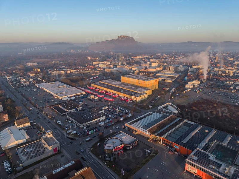 Aerial view of the industrial area of the city of Singen am Hohentwiel, after sunrise, the Hegauberge mountains on the horizon, Konstanz district, Baden-Württemberg, Germany
