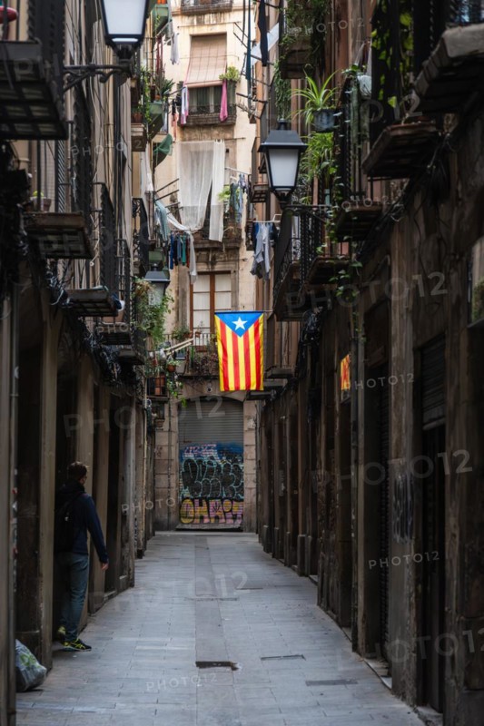 A flag of the Estelada of the Catalan Nationalists in an alley of the historic centre of Barcelona, Spain