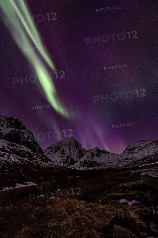 Northern lights over steep mountains, winter, aurora borealis, Flakstadoya, Lofoten, Norway