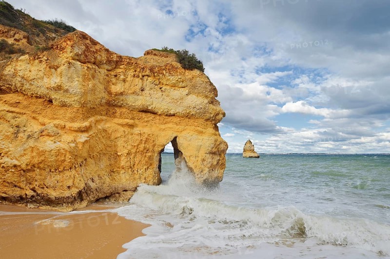 Rocky coast and beach in the surf, Praia do Camilo, Lagos, Algarve, Portugal