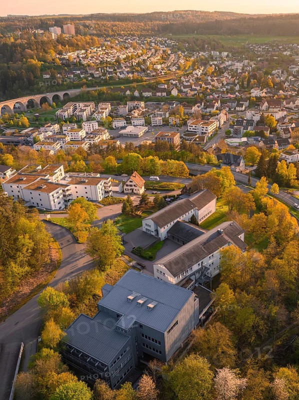 Aerial view of an urban area with houses and trees in a hilly landscape, Nagold, Black Forest, Germany