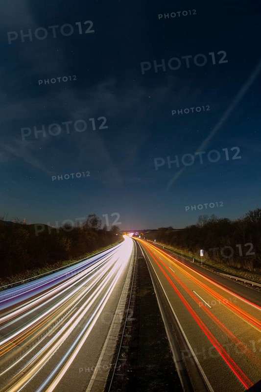 A7 Motorway, Autobahn, beside Kassel at night with light trails from the traffic headlights and taillights, Hesse, Germany