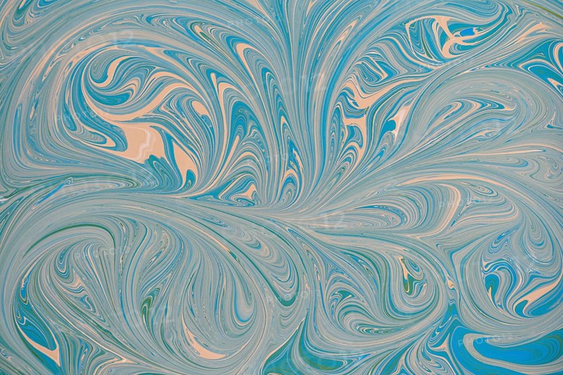 An abstract floral pattern with swirling blue and beige acrylic paint. This dynamic design creates a sense of movement and fluidity, perfect for backgrounds or creative projects