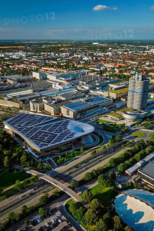 MUNICH, GERMANY, JULY 08, 2018: Aerial view of BMW Museum and BWM Welt and factory and Munich from Olympic Tower. BMW is a famous German luxury car automaker