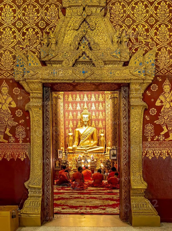 Monks praying at Wat Sensoukharam, Luang Prabang, Laos