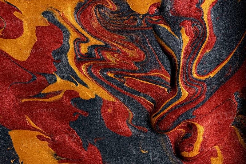 Vibrant swirls of metallic red, gold, and black paints merge, forming a captivating abstract background ideal for artistic and luxury design uses
