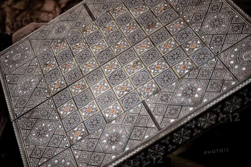 Damascus, Syria. December 10th 2025. Close-up detail of a handmade mosaic wooden backgammon box inside the workshop of Syrian artisan Abu Toni, Bab Touma, Damascus, Syria