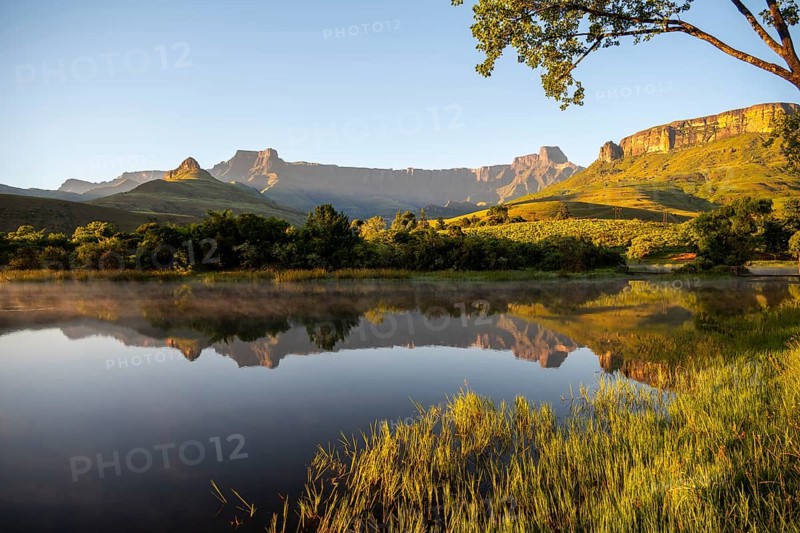 Sunrise, amphitheatre with reflection in the lake, Royal Natal National Park, Drakensberg Mountains south, Kwa Zulu Natal, South Africa
