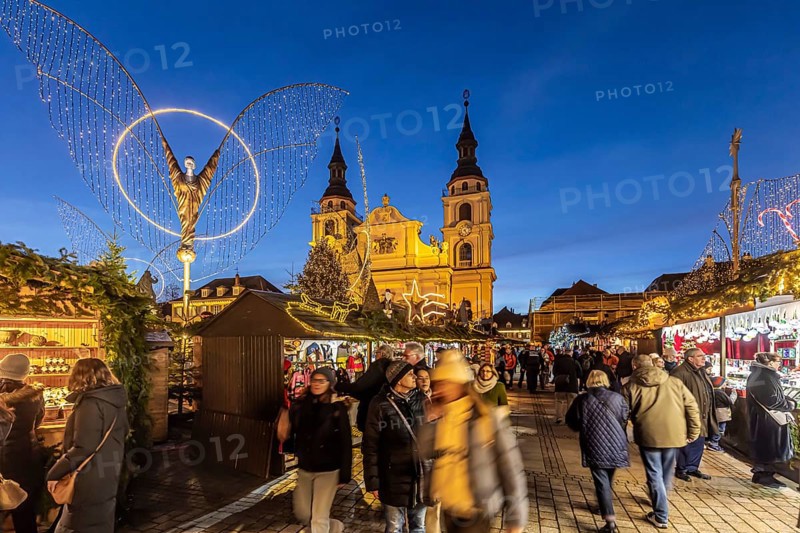 Baroque Christmas market with illuminated angels between the Protestant City Church and the Catholic Church of the Most Holy Trinity. Sights on the market square in the evening. Ludwigsburg, Baden-Württemberg, Germany