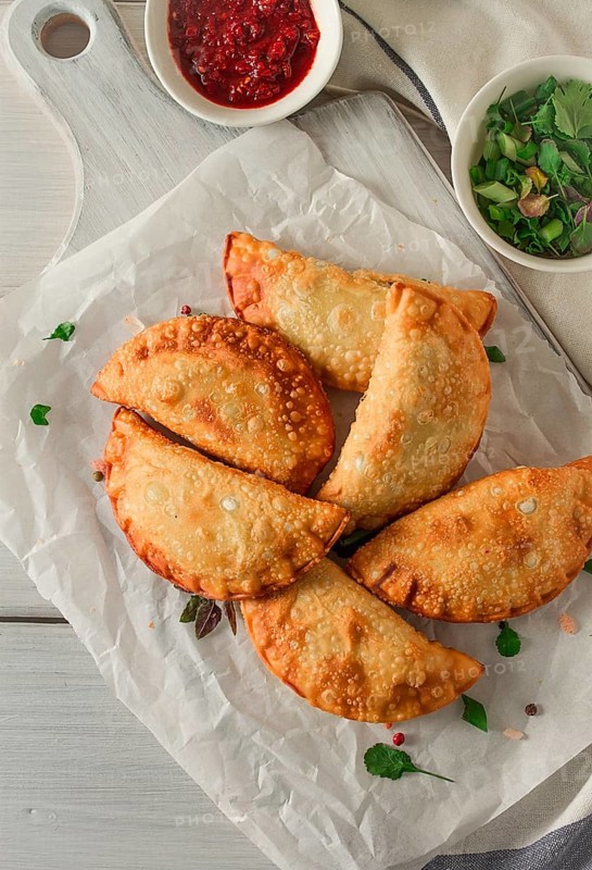 Fried chebureks, close-up, on a light background, no people
