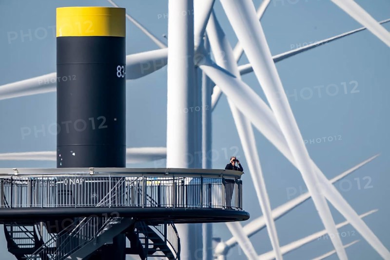Viewing platform at Landtong Rozenburg wind farm, Noordzeeweg, Paal 83 watchtower 22 meters high, behind it 11 Vestas wind turbines, with an output of 34 MW and an annual result of 117 gigawatts, which corresponds to the consumption of approximately 43, 000 households, on a promontory on Nieuwe Waterweg, at Europoort harbour, hub height 130 meters, rotor diameter 26 meters, near Rotterdam, the Netherlands