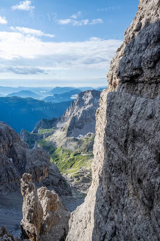 Climbers on a rock band, Bocchette Centrale band trail, via ferrata in the Brenta Mountains, Brenta-Adamello Natural Park, Trentino, Italy