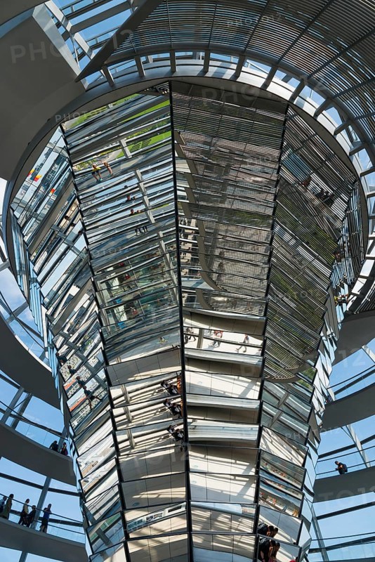 Interior view of the glass dome with mirrored surfaces and people, Reichstag building, German Bundestag, Berlin, Germany