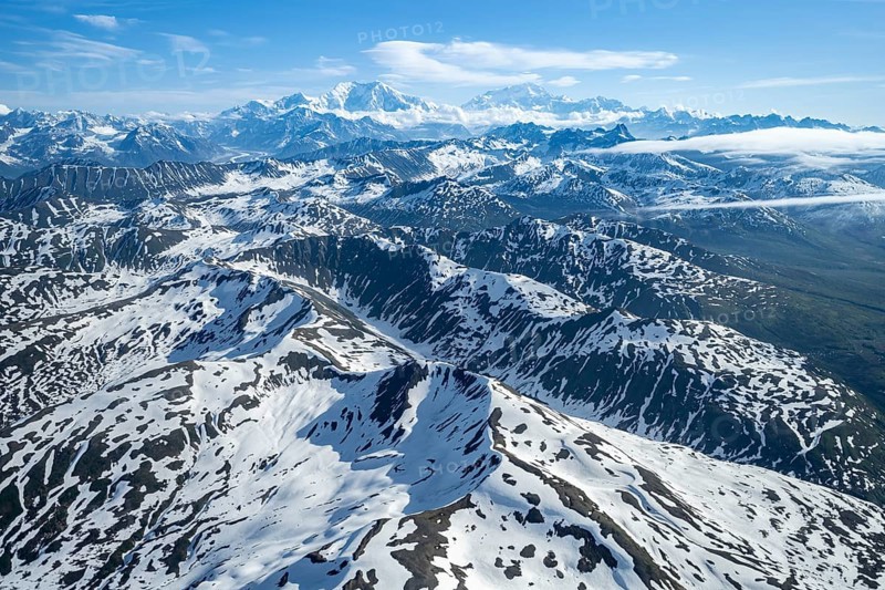 Clouds over high mountains, Mt Foraker and Mt Denali or Mount McKinley, aerial view, Alaska Range, Denali National Park, Alaska, USA