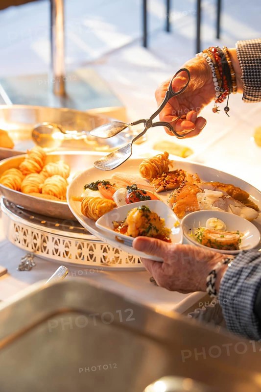 A fine buffet in the restaurant is lovingly presented under a lamp, Europäischer Hof, Königsbach Stein, Germany