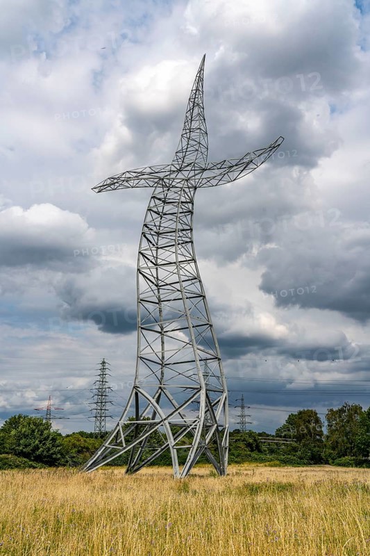 Emscherkunst, artwork Zauberlehrling by the Berlin artist group Inges Idee, an apparently dancing electricity pylon, 35 metres high, in a meadow near Haus Ripshorst in Oberhausen, North Rhine-Westphalia, Germany