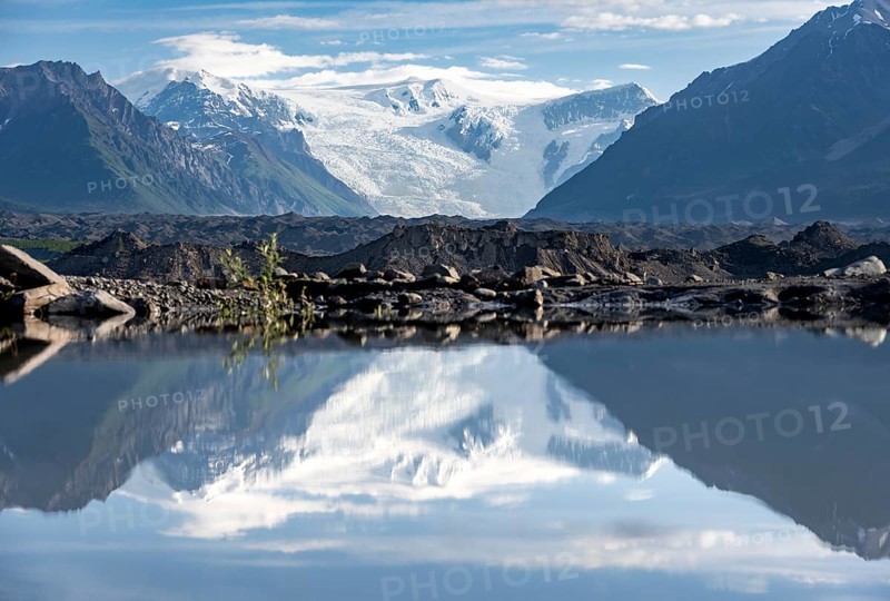 Mountain landscape reflected in glacial lake, Mount Blackburn and Kennicott Glacier, McCarthy Road, Wrangell St. Elias National Park, Alaska, USA