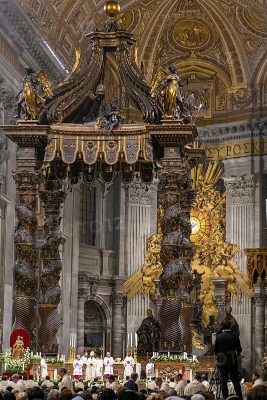 Saint Father Pope Francis with mitre prays in St Peter's Basilica under canopy of Bernini holds Saint Mass Papal Mass in front of audience of believers, Vatican City, Vatican, Rome, Italy