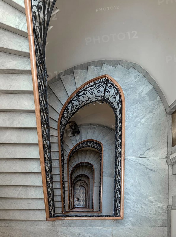 Staircase around 1900 with a wrought-iron banister, in a residential building, Genoa, Italy