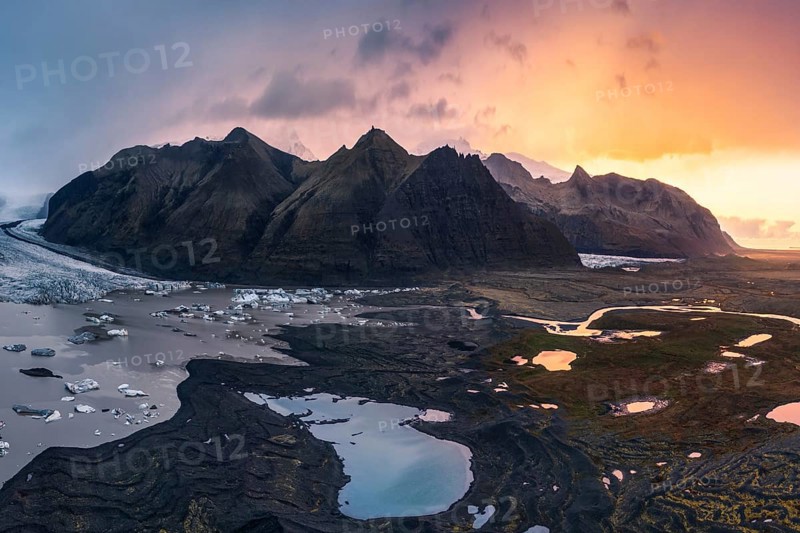 Captivating sunset lighting up the rugged landscape around Vatnajökull Glacier, located within Vatnajökull National Park in Iceland