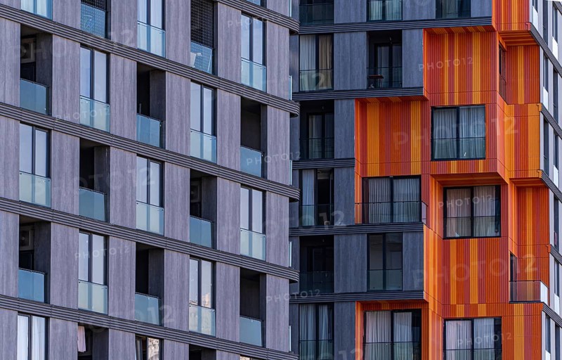 This image captures the essence of modern suburban architecture, featuring a blend of concrete, glass, and metal materials that offer both aesthetic appeal and functionality