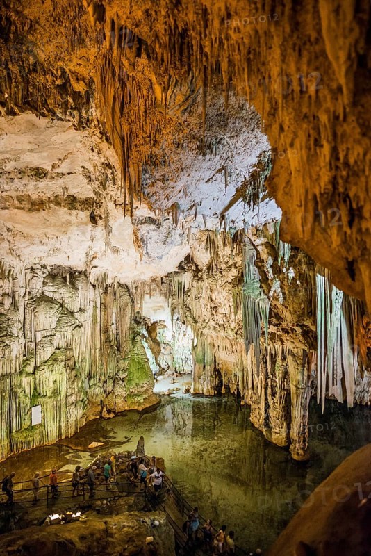 Huge stalactites and underground lake, stalactite cave, Grotta di Nettuno, Neptune Grotto, Capo Caccia, near Alghero, Sardinia, Italy