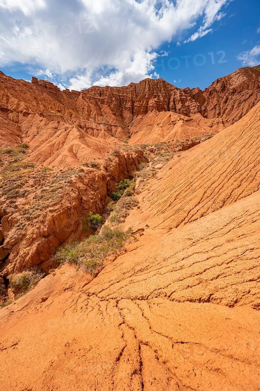 Eroded mountain landscape with sandstone cliffs, canyon with red and orange rock formations, Konorchek Canyon, Chuy, Kyrgyzstan