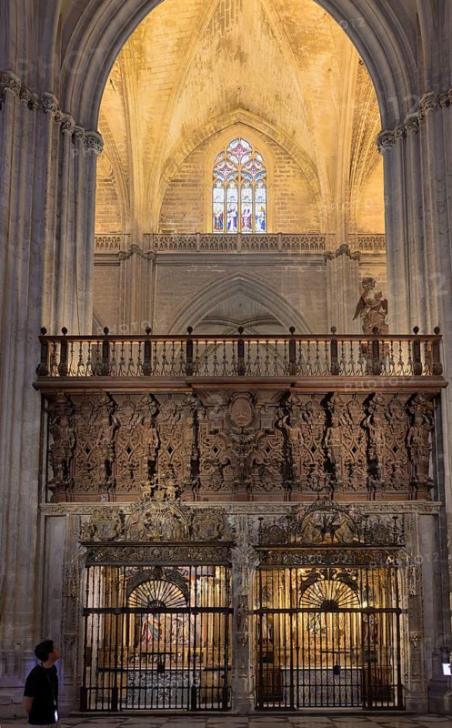 Impressive Gothic church architecture with ornate decorations and light effects, Seville, Andalusia, Spain