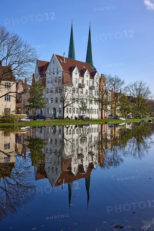 Historic house, towers of Lübeck Cathedral, trees, reflections on the surface of the water, Hanseatic City of Lübeck, independent city, Schleswig-Holstein, Germany