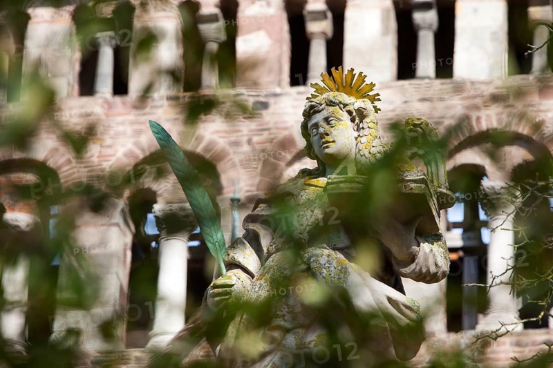 An angel in front of the abbey church St. Stephanus and St. Vitus, Abbey Castle Corvey in Hoexter, Weserbergland, North Rhine Westphalia, Germany