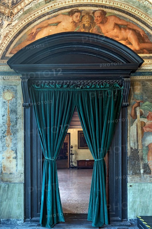 Passageway with velvet curtain in the upper rooms of the Villa del Principe, Palazzo di Andrea Doria, Piazza dei Principe, Genoa. Italy