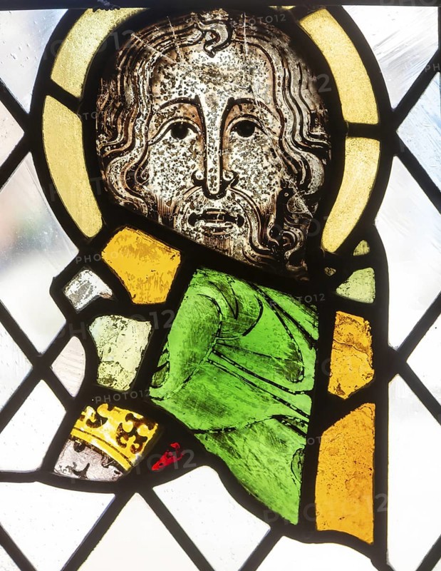 Stained glass window depiction of medieval man face, Bristol cathedral church, Bristol, England, UK