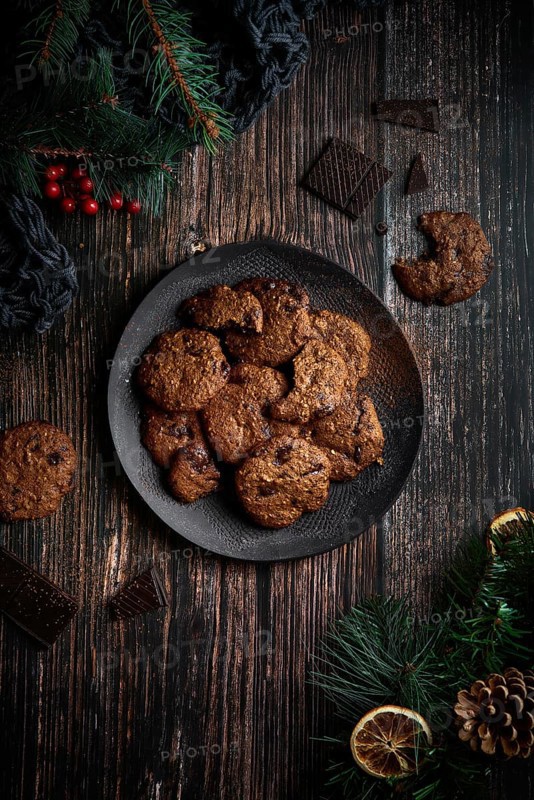 Top view of some tasty chocolate cookies with Christmas decoration
