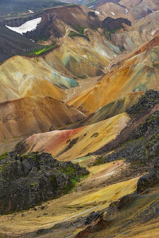 Small river between colourful rhyolite mountains, volcanic landscape, erosion landscape, view from Brennisteinsalda Landmannalaugar, Fjallabak Nature Reserve, Icelandic Highlands, Suðurland, Iceland