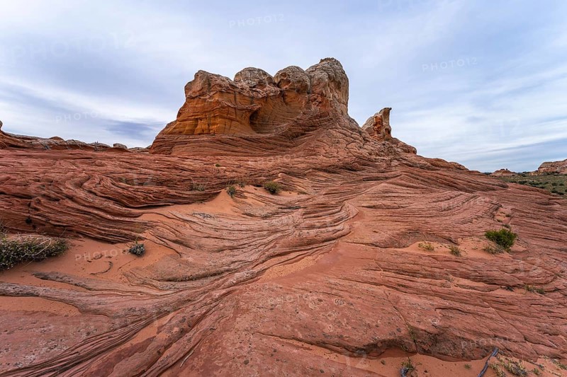 Striking red sandstone formations with intricate patterns in White Pocket, Arizona, epitomize the rugged beauty of the American Southwest