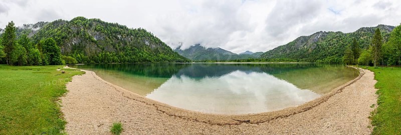 Landscape of Lake Offensee after rain when the sun comes through the clouds in spring, Salzkammergut, Austria