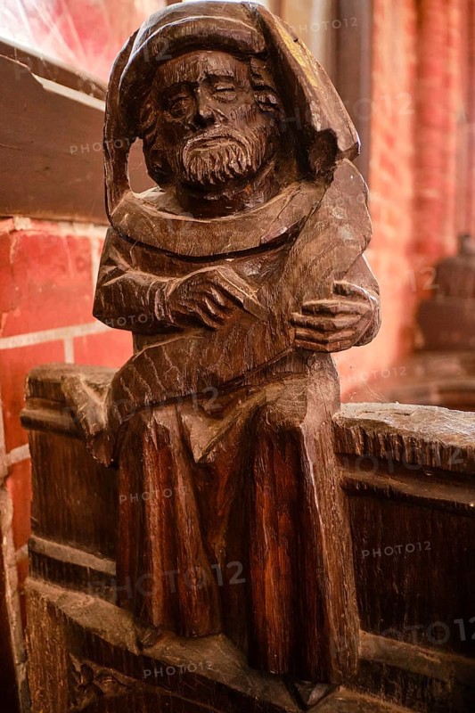 Carved wooden figures on Gothic choir stalls, Nikolaikirche Hanseatic City of Wismar, Mecklenburg-Western Pomerania, Germany