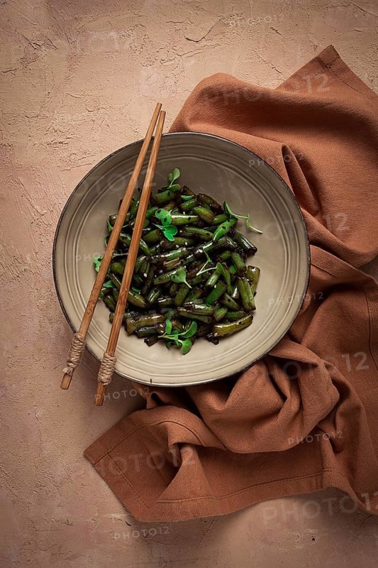 Fried bean pods, in soy sauce, with sesame seeds, homemade, no people