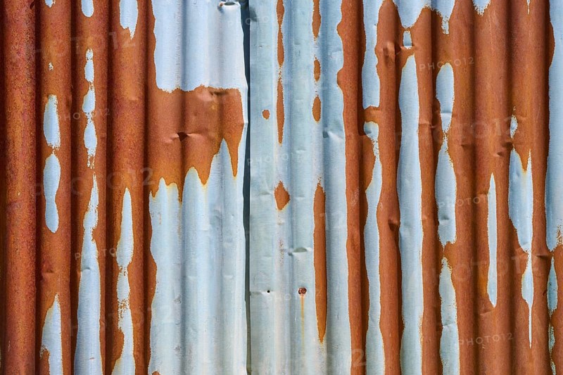 Rusty metal sheets with peeling rust and texture that indicate weathering, Germany