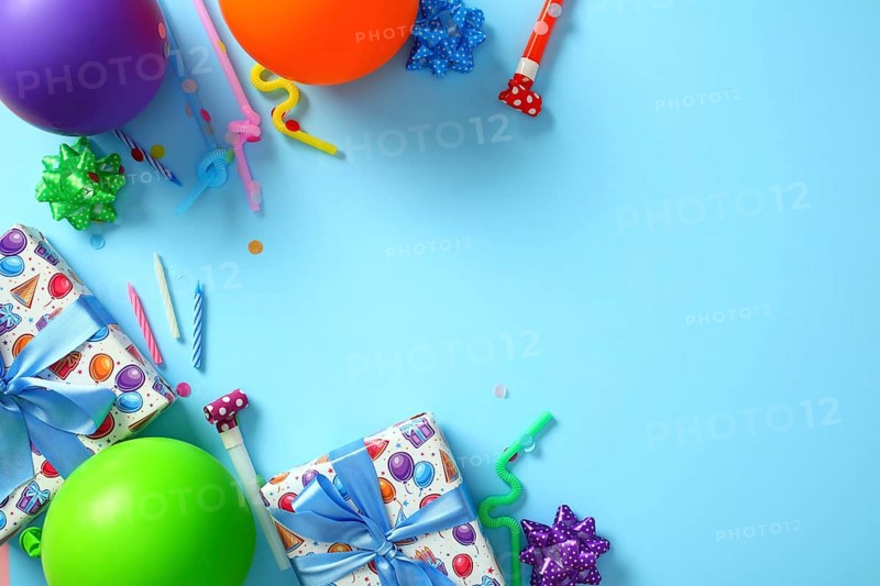 Bright birthday party decorations on blue background. Happy Birthday greeting card template. Flat lay, top view