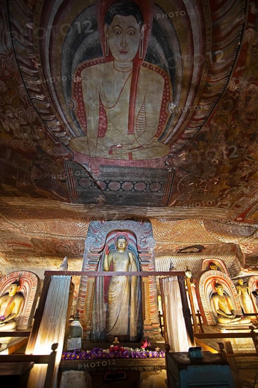 Buddha statues and ceiling fresco in the Dambulla cave temple, Dambulla, Central Province, Sri Lanka