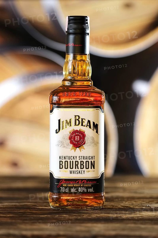 March 28, 2019, Minsk, Belarus, Bottle of kentucky straight bourbon whiskey on wooden table with barrel on background