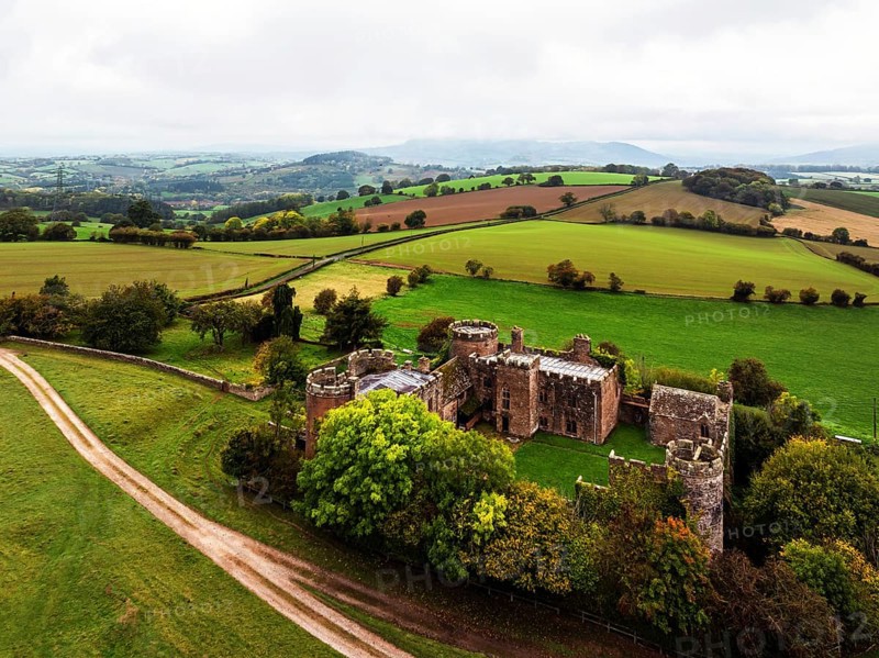 Autumn Colours over ruins of Pembridge Castle or Newland Castle from a drone, Herefordshire, England, United Kingdom