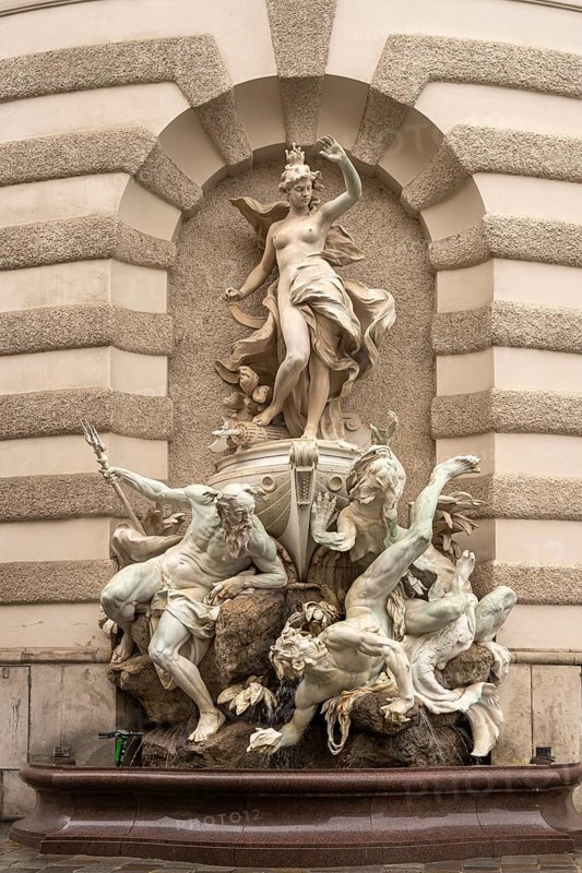 Fountain sculpture Power to the Sea, St Michael's Wing of the Hofburg Imperial Palace Palace in Vienna, Austria