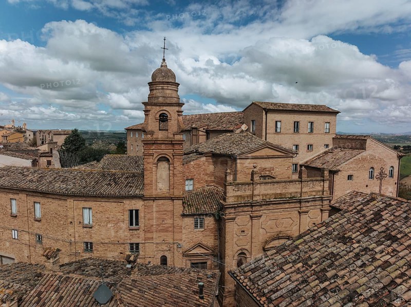 Historic buildings in Treia, Italy, showcase classic architecture with terracotta roofs under a picturesque sky. The composition highlights Italian cultural heritage, ????, ????????, ??????